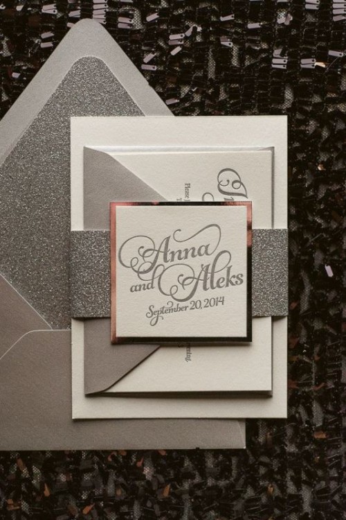 a grey and silver glitter wedding invitation suit with gold framing is a bold glam idea for a winter wedding