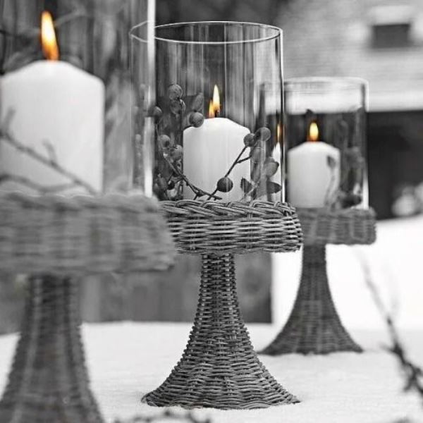 grey woven candleholders with grey berries and white candles inside are very stylish and cool