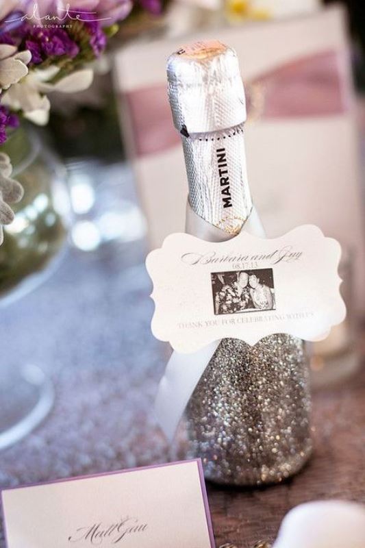 a grey glitter bottle with a photo is a very nice and cool winter wedding favor to rock