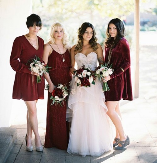 mismatching deep red velvet bridesmaid dresses and silver shoes for a fall boho wedding