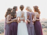 airy lilac and purple maxi bridesmaid dresses with pleated skirts and mismatching backs and necklines are very cool