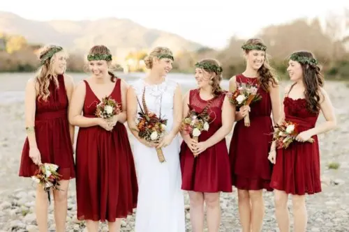 deep red knee bridesmaid dresses with mismatching necklines are amazing for a boho fall wedding