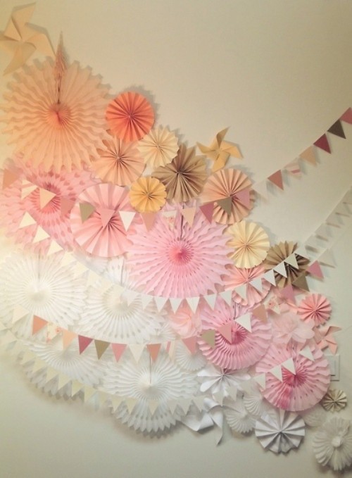 a beautiful and easy colored paper fan wedding backdrop with garlands is a lovely idea that can be DIYed and looks nice