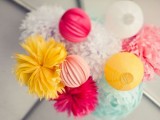 a bright paper pompoms and ball chandelier is a lovely idea for a colorful modern wedding, it’s easy and cheap to DIY