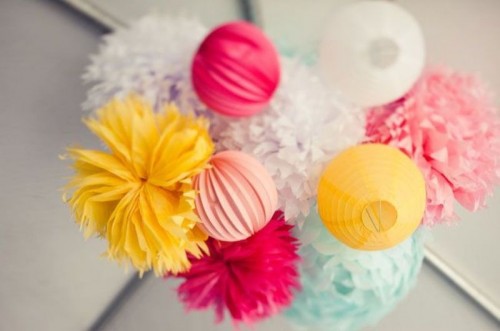 a bright paper pompoms and ball chandelier is a lovely idea for a colorful modern wedding, it's easy and cheap to DIY