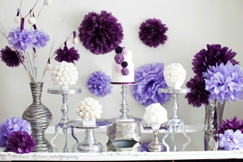 deep and bright purple paper pompoms are great to add color and interest to the wedding dessert table
