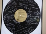 an oversized vinyl with signatures from your guests is a simple and cool guest book