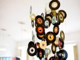 a mobile made of old vinyl is a creative wedding venue decoration for a music-loving wedding