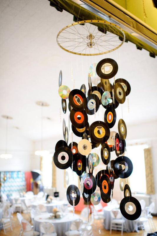 A mobile made of old vinyl is a creative wedding venue decoration for a music loving wedding
