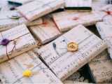wedding favors wrapped into note paper is a cool and fun idea for a modern music-loving wedding
