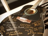 a guitar can be a nice idea of a wedding guest book, you can hang it on the wall for decor after the wedding