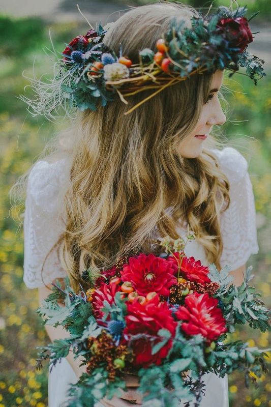 a bright boho fall floral crown with neutral, burgundy blooms, thistles, seed pods, berries, twigs and foliage is gorgeous