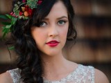 a colorful fall floral crown with greenery, succulents, berries and deep red blooms is a gorgeous idea to rock