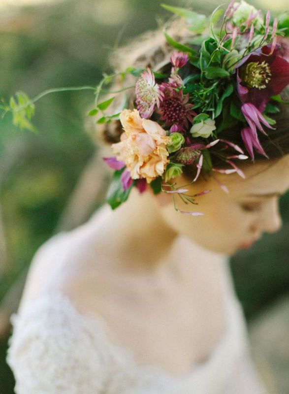 a bright fall floral crown with a peachy and some purple blooms, with lots of textural greenery is a very cool idea