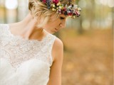 a colorful fall floral crown with berries, seed pods, pale greenery and fuchsia blooms is a catchy and cute idea