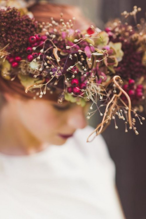 a bold and dimensional fall floral crown with fuchsia, deep red blooms, dried flowers and twigs and berries is a fantastic idea