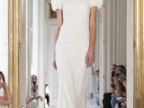 a modern fitting wedding dress with a high neckline and puff sleeves for a romantic elopement