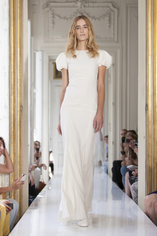 A modern fitting wedding dress with a high neckline and puff sleeves for a romantic elopement