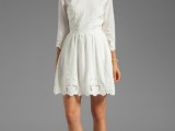 a simple white over the knee dress with a high neckline and short sleeves plus a lace edge is a chic idea