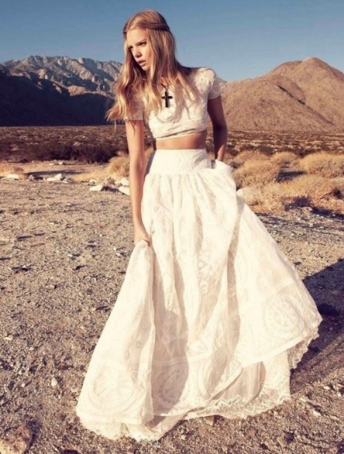 a lace two piece elopement wedding dress with a crop top, short sleeves, a high neckline and A-line skirt for a boho elopement