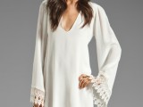 a plain boho high low mini dress with lace edge bell sleeves is a cool idea to rock for your boho or 70s elopement