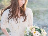 a vintage lace midi wedding dress with short sleeves, layered necklaces and a floral crown