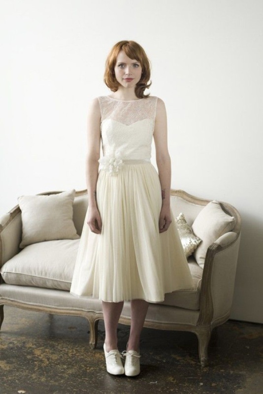A vintage midi dress with a lace bodice and a pleated skirt, white vintage shoes and a floral sash