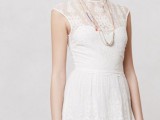 a white lace mini dress with caps sleeves, an illusion neckline and layered necklaces for a simple city hall elopement