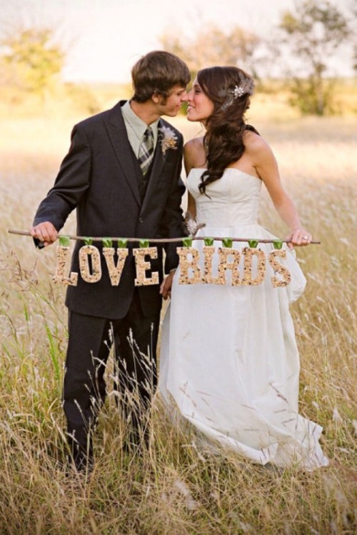 a branch with corks forming words love birds is a cool rustic wedding decoration to rock