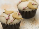 cupcakes with icing and with birds on top to hint on love birds are amazing for any wedding, cool desserts with a romantic feel