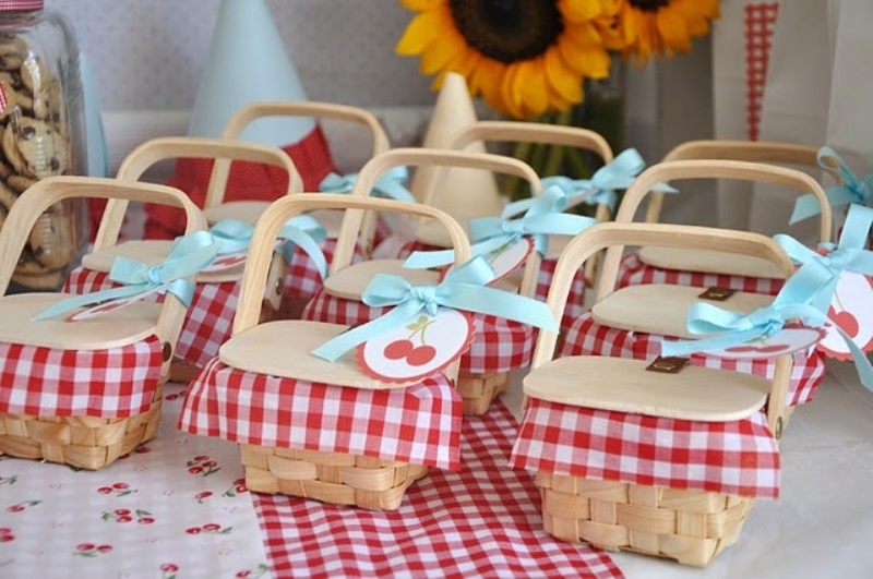 Closed boxes with checked fabric and cheeries inside plus cherry tags is ideal for rustic weddings and rehearsal dinners