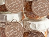 corn in jar with tags for making homemade popcorn is a great favor idea for rehearsal dinners and weddings