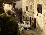hire a retro car to escape and ride along the narrow streets of Tuscany and enjoy the beautiful architecture