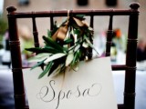 decorate your wedding chairs with signs in Italian and olive wreaths for embracing the location