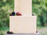 go for a simple square wedding cake topped with fresh local fruits and berries and enjoy