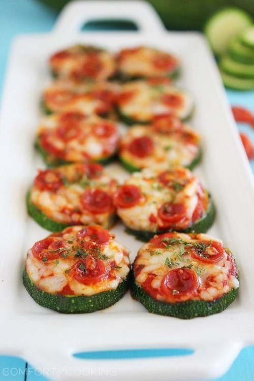 zucchini slices topped with cheese, herbs and mini tomatoes are amazing vegetarian wedding appetizers, great for summer and fall weddings