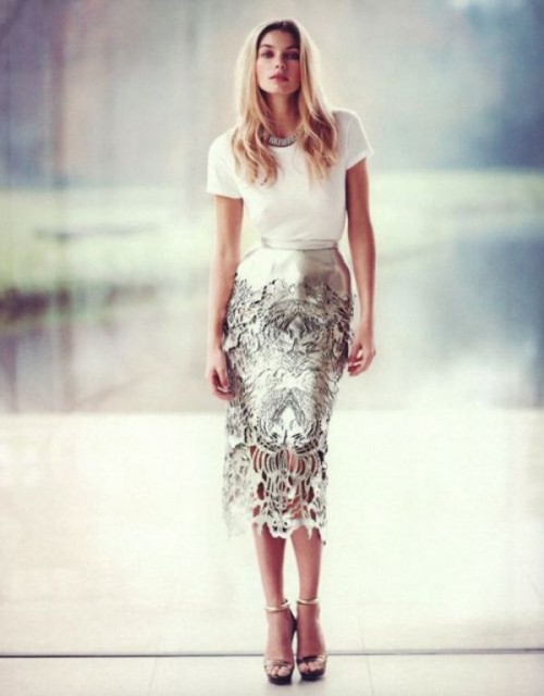 a white top, a metallic laser cut midi pencil skirt, metallic ankle strap shoes and a statement necklace