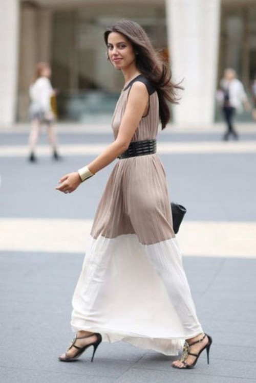 a statement color block maxi pleated dress with black shoulders, a taupe bodice and a white skirt, black heels and a bag for a fall wedding