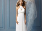 a Grecian-style wedding dress with a halter neckline, a cutout element and an embellished sash to highlight the dress