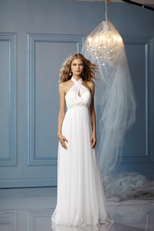 A Grecian style wedding dress with a halter neckline, a cutout element and an embellished sash to highlight the dress
