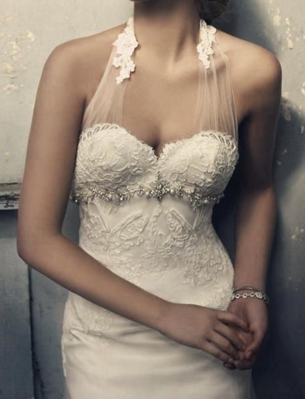 A creative lace embellished sheath wedding dress with a halter neckline is a chic and refined idea