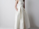 an A-line midi wedding dress with a lace bodice and a plain pleated skirt plus pockets