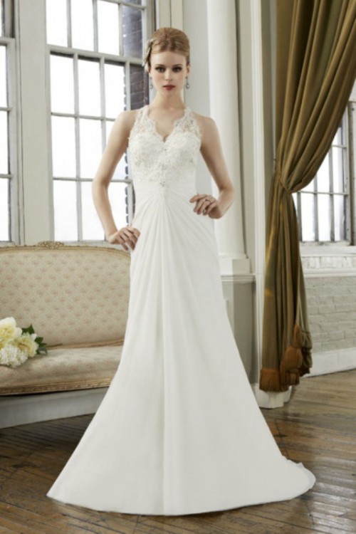 a vintage-inspired A-line lace wedding dress with a halter neckline, a draped bodice and embellishments