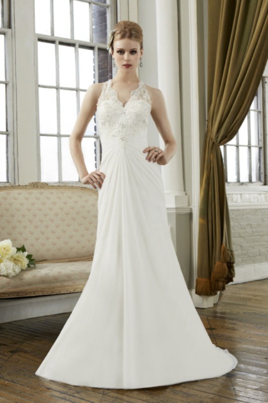 A vintage inspired A line lace wedding dress with a halter neckline, a draped bodice and embellishments