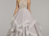 a grey princess-style wedding gown with a lace embellished bodice and a layered skirt
