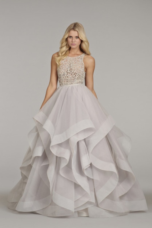 A grey princess style wedding gown with a lace embellished bodice and a layered skirt