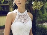 an A-line wedding dress with a lace embellished bodice with a halter neckline, a plain skirt for a modern glam bride