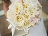 a bouquet made of neutral and blush roses is classics for a spring or summer wedding
