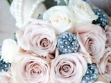 a dusty pink and white rose wedding bouquet accented with pearls is a cool and fresh idea