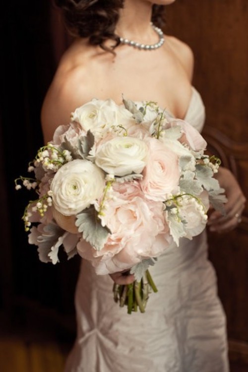 a pastel wedding bouquet of white and blush blooms, pale millet and some lilies of the valley